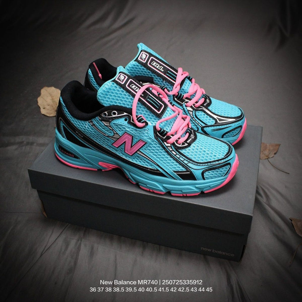 The New Balance 740v2 Cyber Jade features a breathable mesh upper with vibrant blue and neon pink accents, inspired by 2000s running style