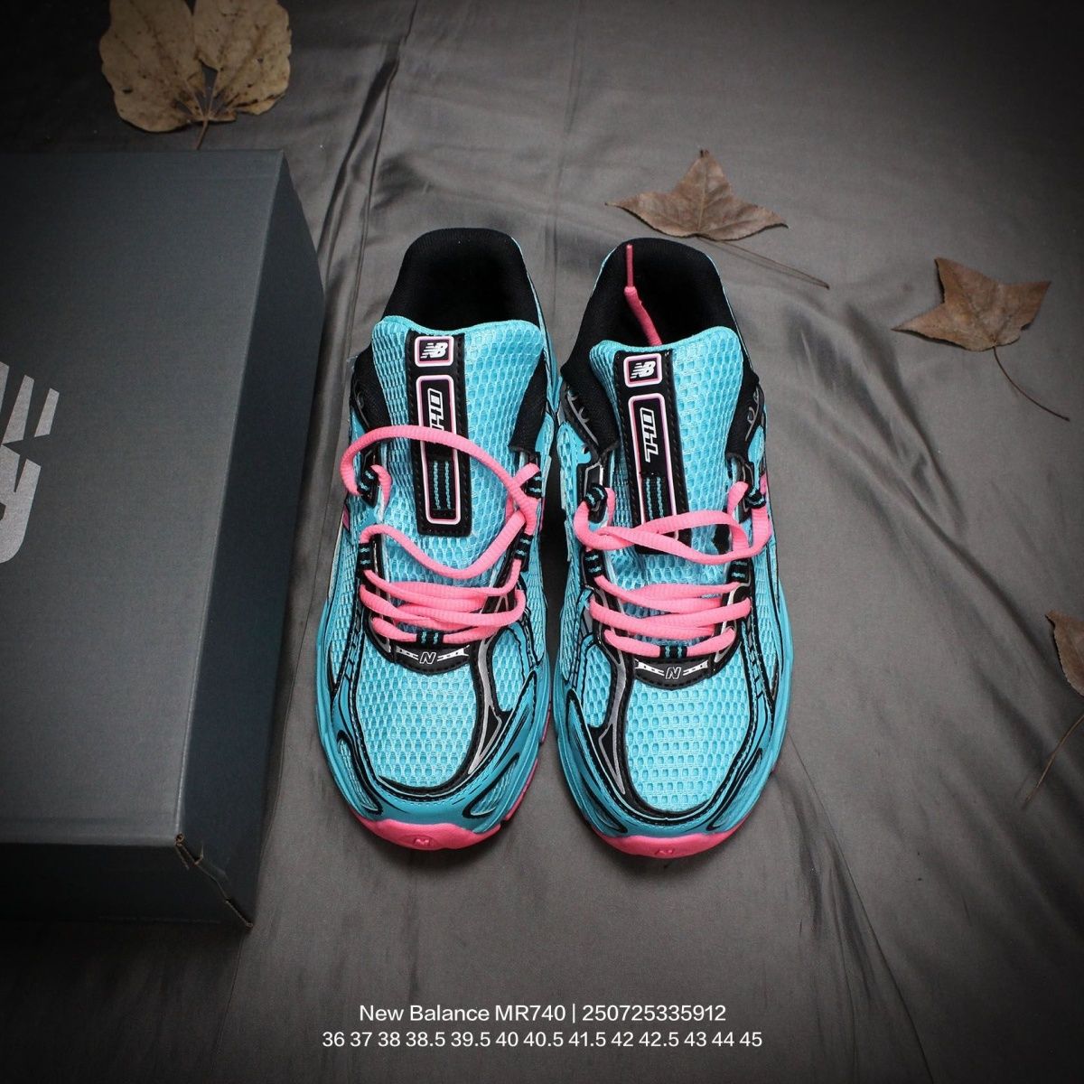 The New Balance 740v2 Cyber Jade features a breathable mesh upper with vibrant blue and neon pink accents, inspired by 2000s running style